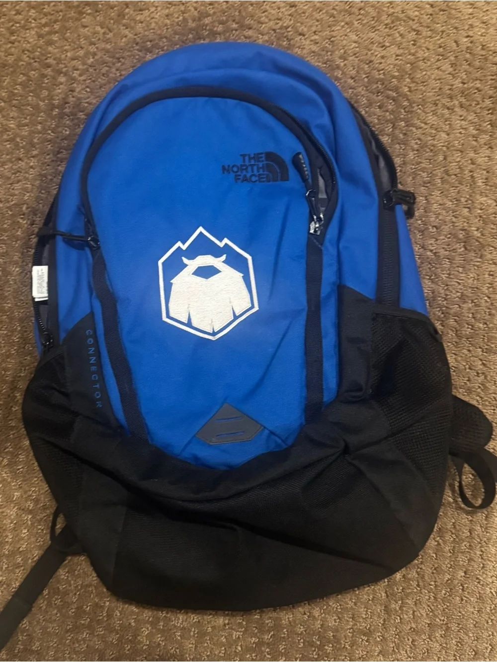 The North Face Blue and Black Backpack with Front Logo Connector